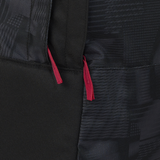 Close-up of the England 26/27 Backpack by Castore, featuring a sleek black design with two red zipper pulls that showcase its stylish and durable construction.
