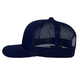 The EMB Augusta USA Rugby Elevated Eagle Braid Trucker Cap, shown in side profile, features a navy blue solid front panel, mesh back, and the Elevated Eagle logo inspired by USA Rugby.