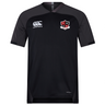 The Southern Pines Youth Rugby Vapodri Evader Jersey by EMB Canterbury is a black short-sleeve jersey featuring the Canterbury logo on the right and a shield emblem on the left. Designed with VapoDri technology, it keeps you cool and dry.