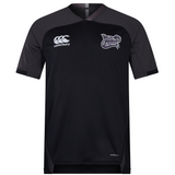 The Valley Panthers Girls Rugby Vapodri Evader Jersey by EMB Canterbury is a black, short-sleeved performance rugby shirt featuring the Valley Panthers Girls Rugby logo on the chest, a Canterbury brand logo, and subtle dark gray shoulder panels. Designed with moisture-wicking Vapodri technology for high performance both on and off the field.