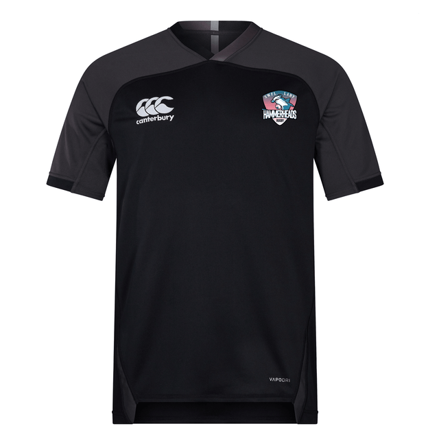 The SWFL Lady Hammerheads Vapodri Evader Jersey by WRS Canterbury features black short sleeves, dark gray sleeves, moisture-wicking tech, a Canterbury logo, and a USA Hammers crest—ideal for Rugby World Cup fans.