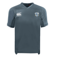 The Milwaukee Barbarians Rugby Vapodri Evader Jersey by EMB Canterbury is a gray short-sleeve rugby top with a V-neck, moisture-wicking fabric, the Canterbury logo on the right chest, and the club crest on the left.