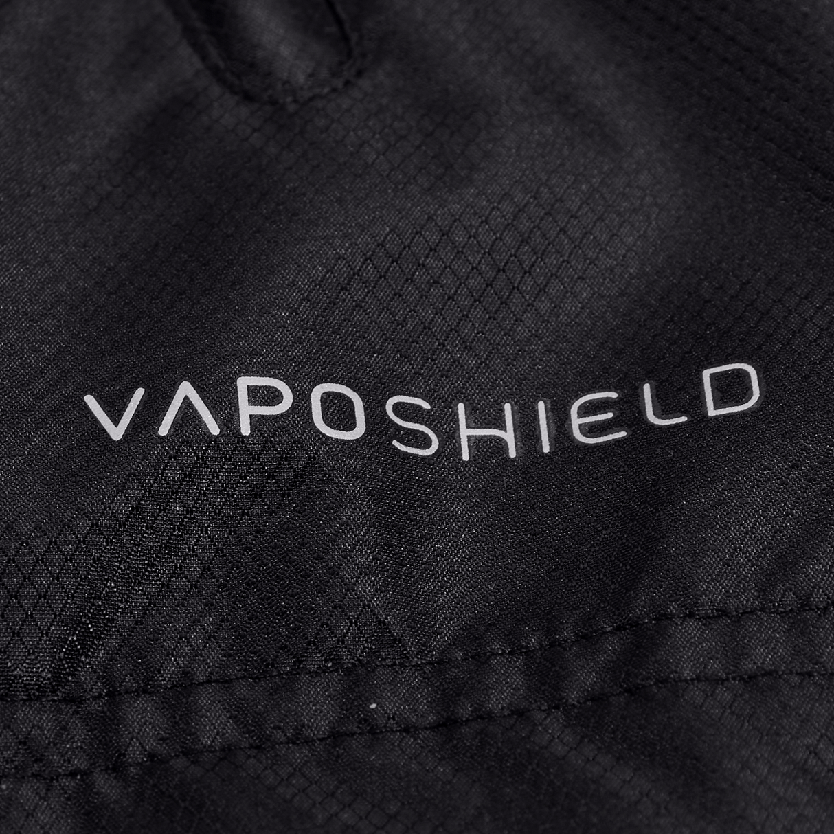 A close up of a black jacket with the words Canterbury Pro II Vaposhield Full-Zip Water Resistant Jacket on it.