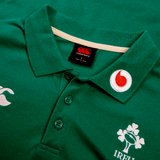 The Ireland 24 Team Polo by Canterbury is a green rugby jersey featuring ribbed collar, cuffs, three buttons, and embroidered logos of Canterbury, Vodafone, and a shamrock with "IRELAND.