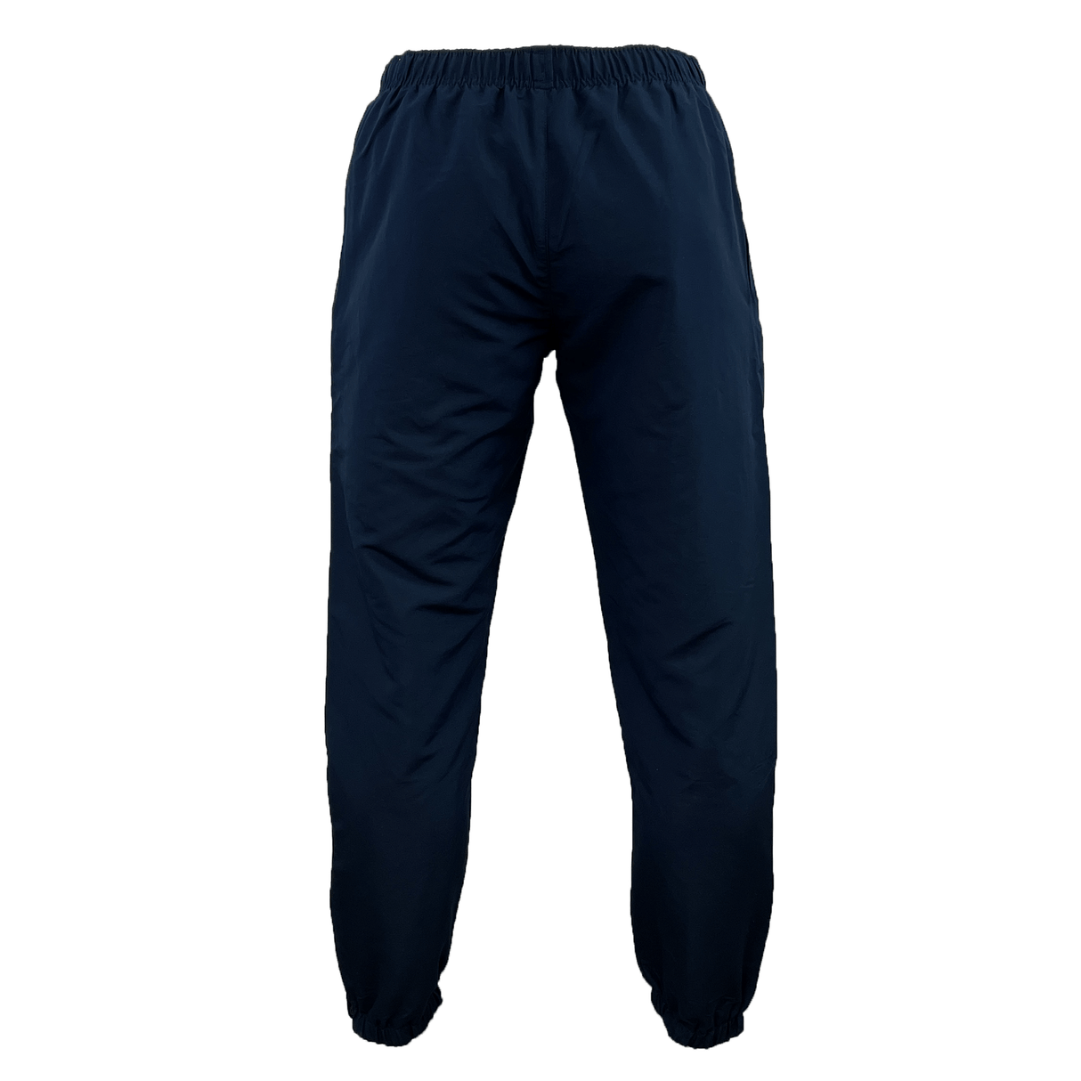 The Canterbury Team Tonal Taper Leg Cuffed Trackpant in navy blue boasts a tapered fit with an elastic waistband and cuffs, combining comfort and style.