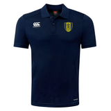 A navy blue Gotham Knights Club Dry Polo shirt by EMB Canterbury, featuring short sleeves, a yellow and black shield emblem on the left chest, and white logos on the right chest and sleeve. The shirt integrates Vapodri Technology to ensure breathability for ultimate comfort.