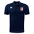 The Montgomery Bucks Griffins Club Dry Polo by EMB Canterbury is a navy short-sleeve polo with a red and white lion crest, Vapodri tech for breathability, and Canterbury logos on the right chest and lower left side.