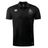The Birmingham Iron Women's Football Club Dry Polo by EMB Canterbury is a black, short-sleeve collared polo featuring Vapodri technology, a white Canterbury logo on the right chest, and the Iron team crest on the left.