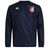 The Montgomery Bucks Griffins Club Vaposhield Contact Top by EMB Canterbury is a navy long-sleeve rugby top with the Canterbury logo on the right chest, a red and white lion crest on the left, and water-resistant Vaposhield technology.