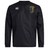 The Spartan Youth Rugby Club Vaposhield Contact Top by EMB Canterbury is a black long-sleeve top featuring the Canterbury logo on the right chest and a yellow Spartan Sports Academy logo on the left, with Vaposhield technology for comfort.