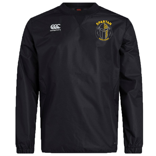 The Spartan Youth Rugby Club Vaposhield Contact Top by EMB Canterbury is a black long-sleeve top featuring the Canterbury logo on the right chest and a yellow Spartan Sports Academy logo on the left, with Vaposhield technology for comfort.