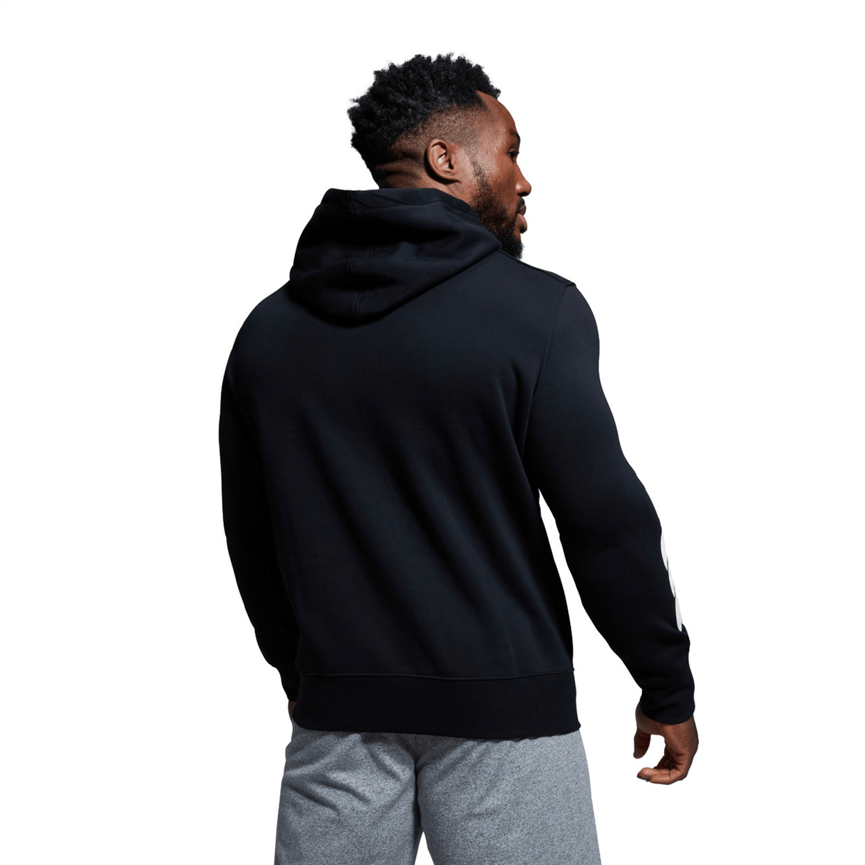 The back view of a man wearing a Canterbury Rugby Club Hoodie that has been customized.