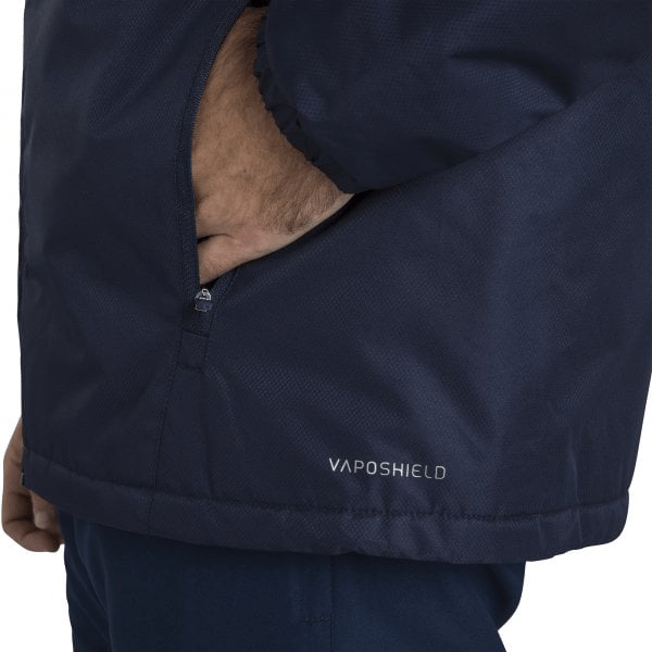 A man in a Canterbury Club Vaposhield Stadium Jacket with a pocket on his back.