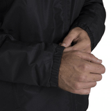 A man wearing a Canterbury Club Vaposhield Stadium Jacket with a hood.