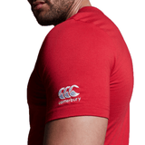 Man wearing a red short-sleeve WRS Canterbury Pennsylvania CCC Flag Club T-shirt, featuring a white Canterbury logo on the sleeve, shown from the side against a white background—ideal for displaying your Pennsylvania rugby pride.