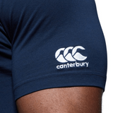 Close-up of a person's upper arm wearing a navy blue WRS Canterbury North Carolina CCC Flag Club T-shirt, featuring the white "canterbury" logo and emblem on the sleeve.