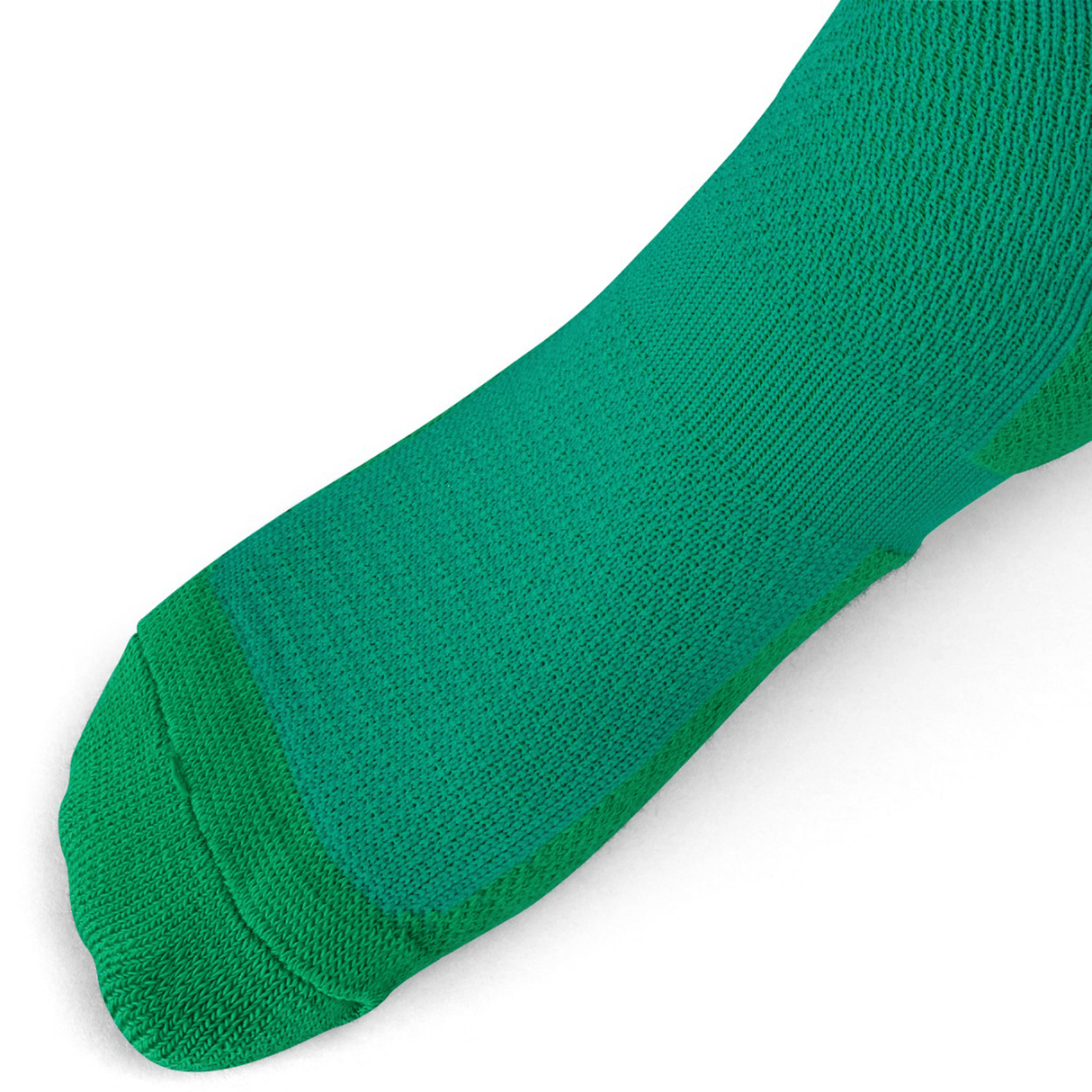 Close-up of a foot wearing the Ireland 24 Home Sock by Canterbury. The green textured sock appears snug and covers the foot and part of the ankle. The background is white.