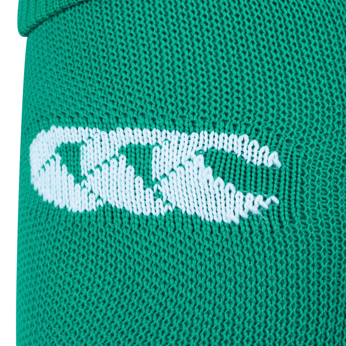 Close-up of a green fabric with a white embroidered logo featuring three interlocking shapes, reminiscent of the iconic Ireland 24 Home Sock by Canterbury.