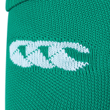 Close-up of a green fabric with a white embroidered logo featuring three interlocking shapes, reminiscent of the iconic Ireland 24 Home Sock by Canterbury.