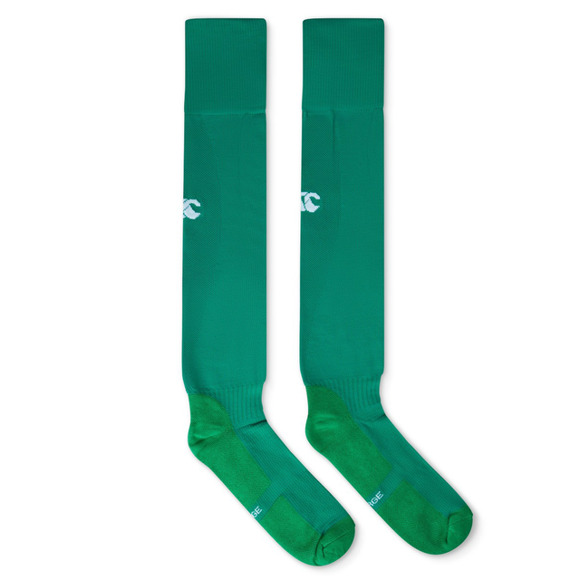 A pair of long, green Ireland 25/26 Home Socks by Canterbury with white logo details near the top, laid flat side by side on a white background.