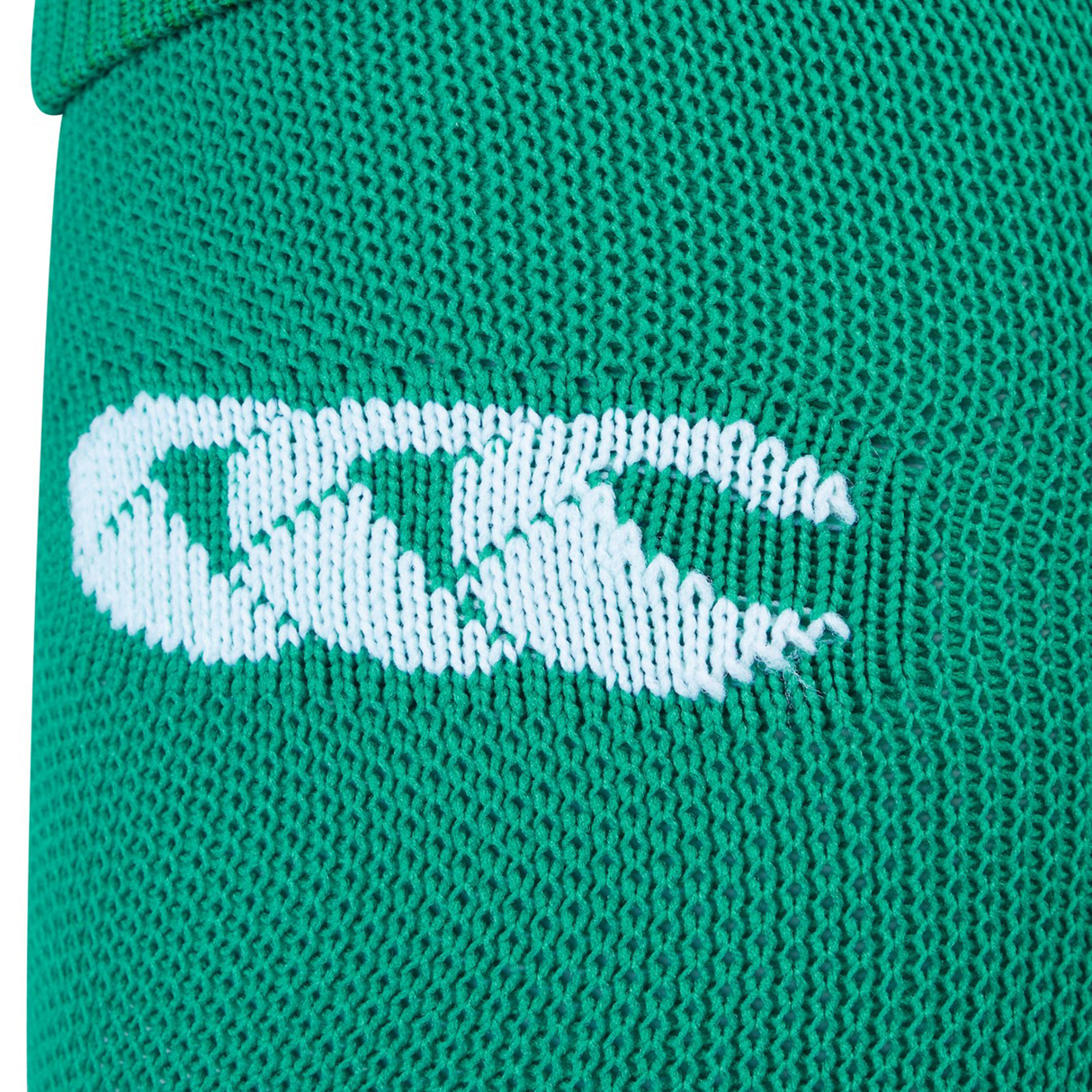 Close-up of green knitted fabric with a white Canterbury logo, highlighting the quality of the Ireland 25/26 Home Socks by Canterbury.