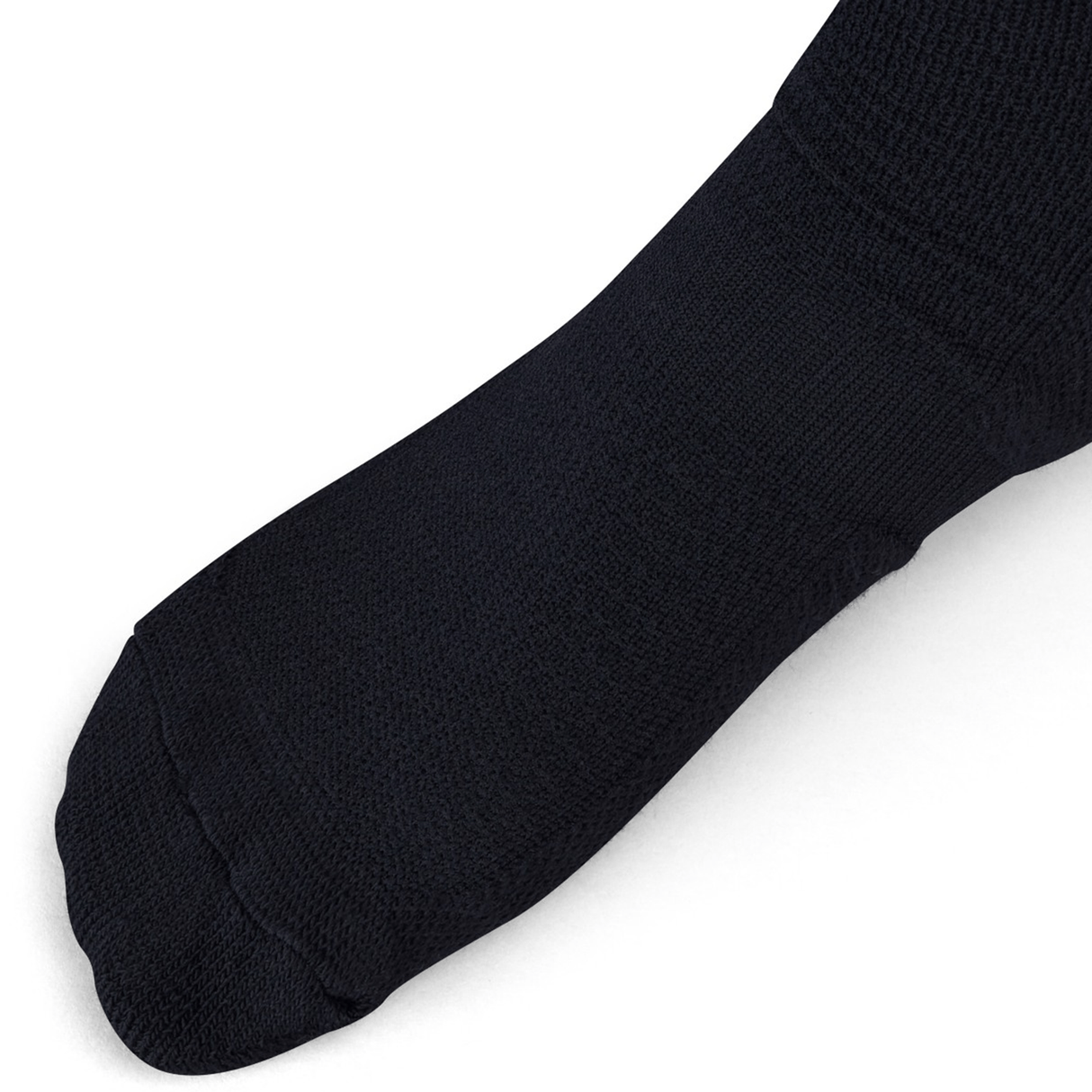 Close-up of an Ireland 24 Alternate Sock by Canterbury in black, covering a foot and highlighting its ankle and arch support, set against a white background.