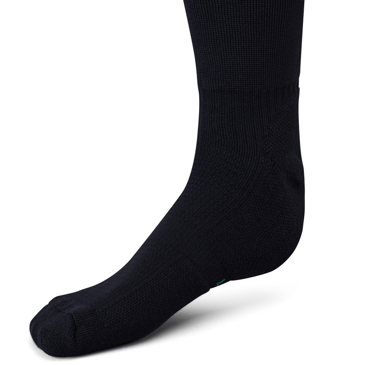Close-up view of a black Ireland 24 Alternate Sock by Canterbury worn on a foot, featuring fast-drying performance yarn and ankle and arch support.
