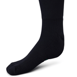 Close-up view of a black Ireland 24 Alternate Sock by Canterbury worn on a foot, featuring fast-drying performance yarn and ankle and arch support.