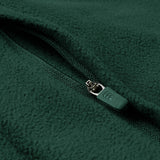 Close-up of the Ireland 26 Retro Fleece 1/4 Zip by Canterbury in green, showing the textured fleece fabric and a partially closed branded zipper pull.