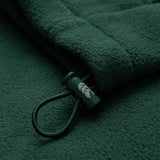 Close-up of the Ireland 26 Retro Fleece 1/4 Zip by Canterbury, showcasing its dark green fleece fabric, cord with a plastic toggle adorned with a small white leaf design—evoking the classic style of vintage Canterbury training pullovers.