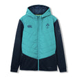 The Ireland 26 Hybrid Padded Jacket by Canterbury is a teal and navy zip-up hooded jacket featuring a quilted front, side pockets, and Canterbury logos on the chest and sleeve—ideal as a rugby training jacket for cooler days.