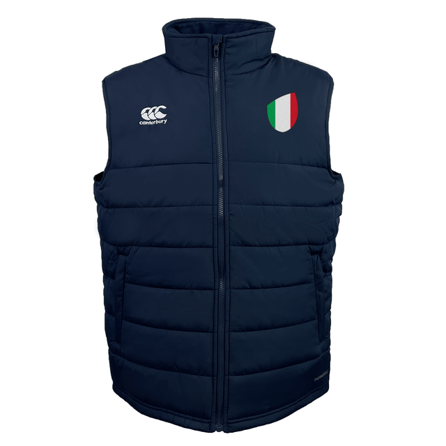 The EMB Canterbury Italy Shield Core Gilet is a navy blue puffer vest featuring a zip, with a logo on the left and an Italy Shield on the right.