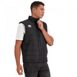 A man wearing a Canterbury Core Gilet vest and a white t-shirt.