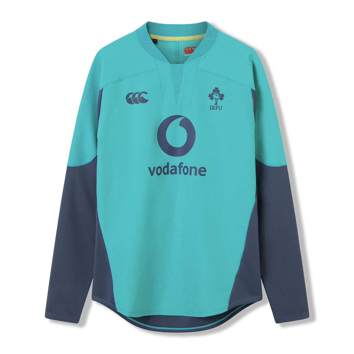 The Ireland 26 Tech Drill Top by Canterbury is a long-sleeved rugby jersey in teal and navy, inspired by IRFU training wear, with the Vodafone logo and IRFU crest on the chest, shown against a plain white background.