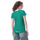 A person in light blue jeans is looking over their shoulder, wearing a green Women's Ireland WIRFU Home Pro Jersey by Canterbury with the "Vodafone" logo and Official IRFU crest. The jersey features VapoDri technology for enhanced comfort and performance.