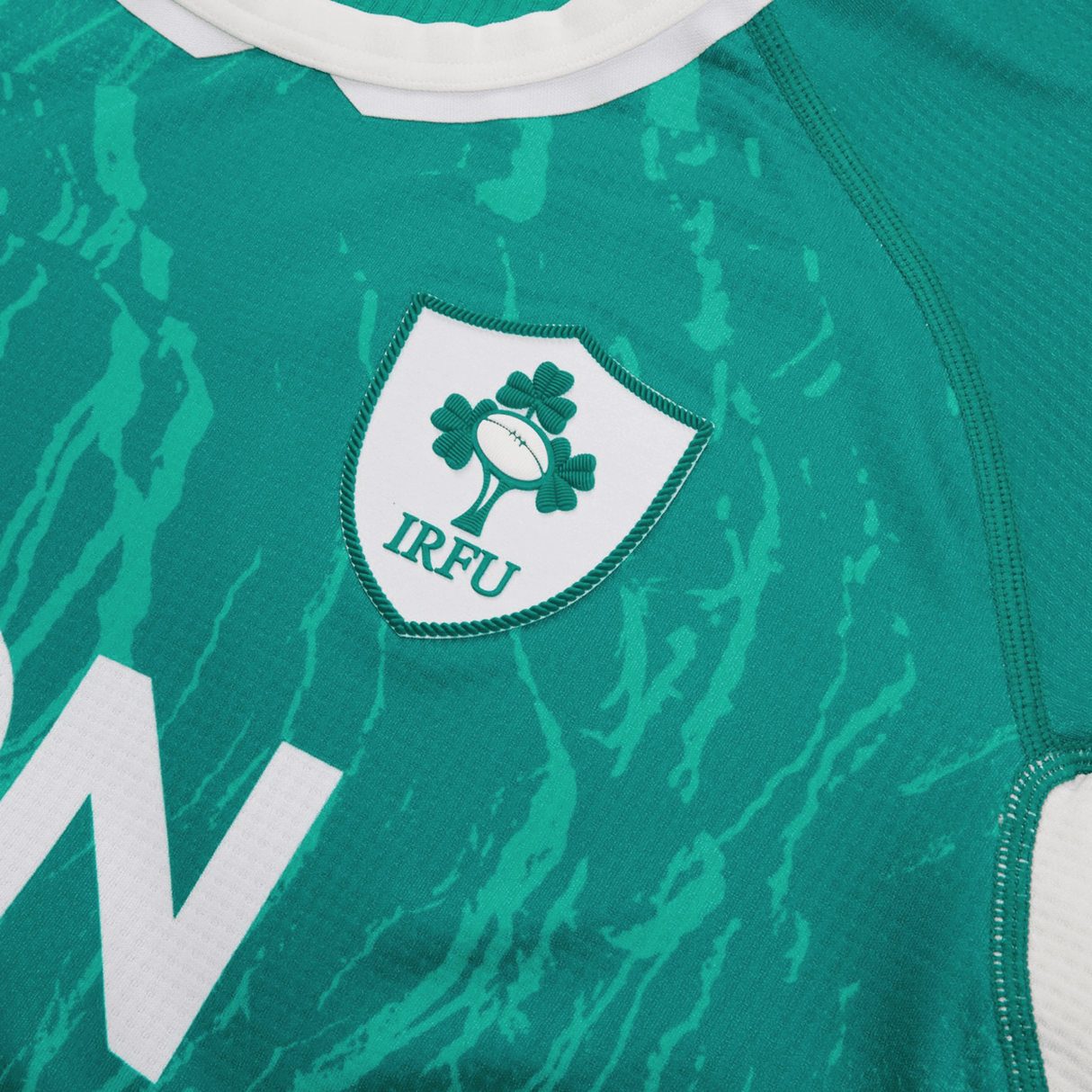 Women's Ireland WIRFU Home Pro Jersey by Canterbury showcases the Official IRFU crest with a rugby ball and shamrocks, enhanced by VapoDri technology for the perfect blend of tradition and comfort.