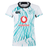 The Women's Ireland 24 Alternate Pro Jersey by Canterbury features an abstract green pattern on a white and teal rugby jersey. It prominently displays the Vodafone, IRFU logos, and the IRFU Crest, combining style and tradition for fans.