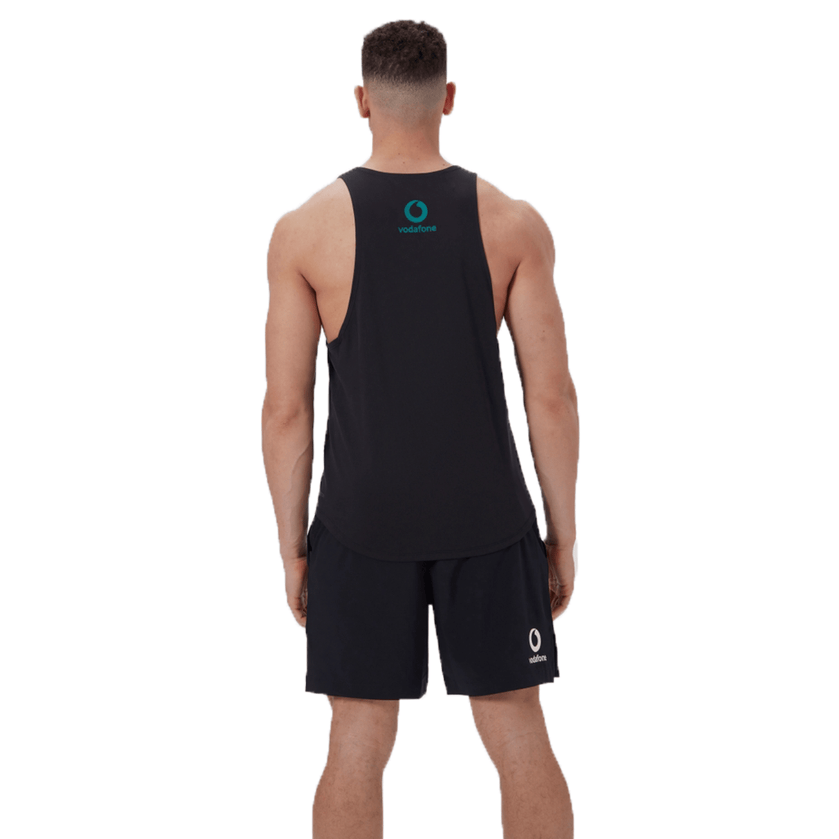 Rear view of a person wearing the Canterbury Ireland 24 Poly Training Singlet and shorts, made from quick-drying fabric, against a white background.