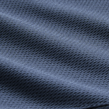 Close-up of dark blue textured fabric with a diagonal weave and soft folds, showcasing the premium quality of the Canterbury Ireland 26/27 Summer Tour Superlight Training Singlet.