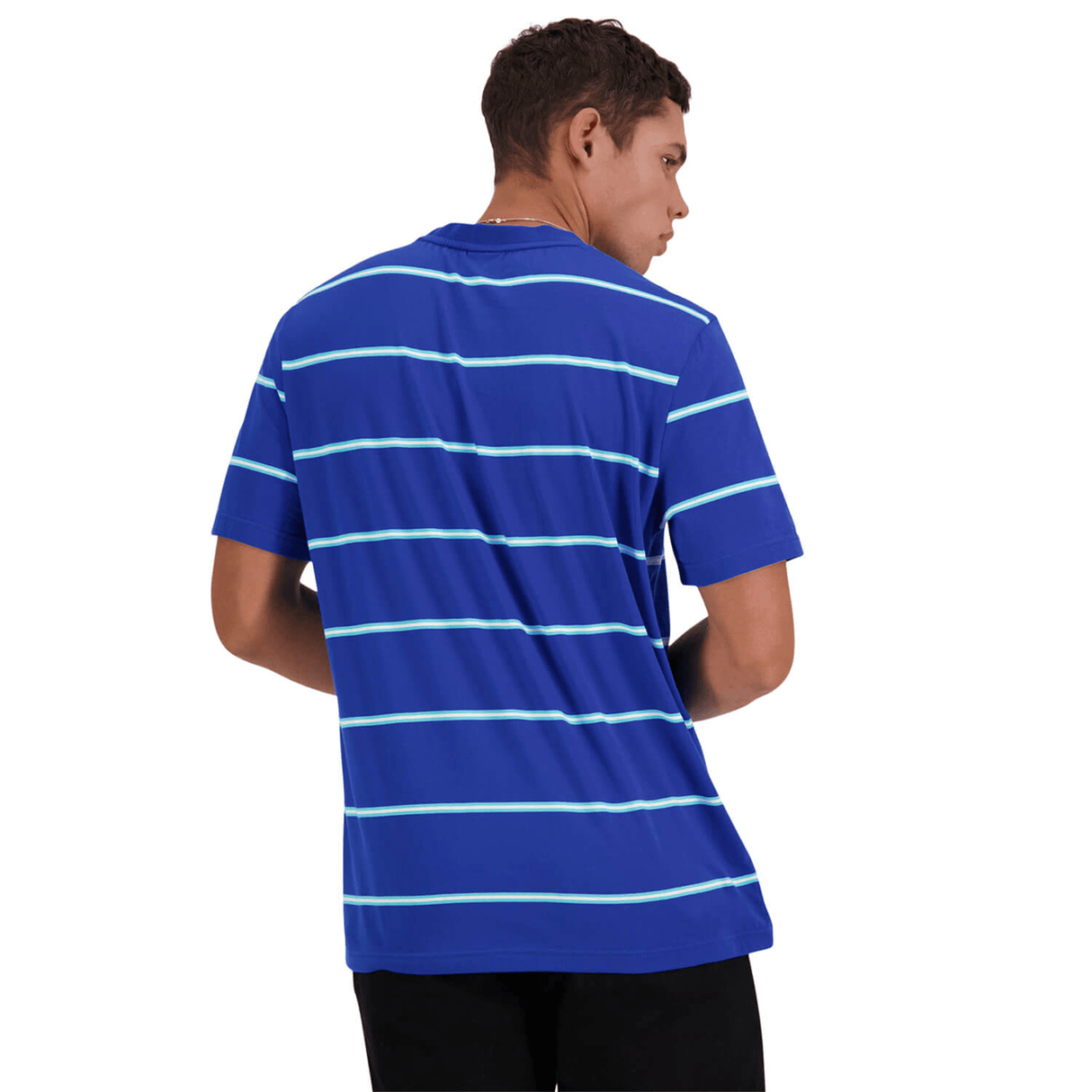 A person in a blue and neon green striped Canterbury Yarn Dye T-Shirt by Canterbury, made of 100% cotton, is shown from the back, looking to the side. The shirt has short sleeves and they are wearing black pants.