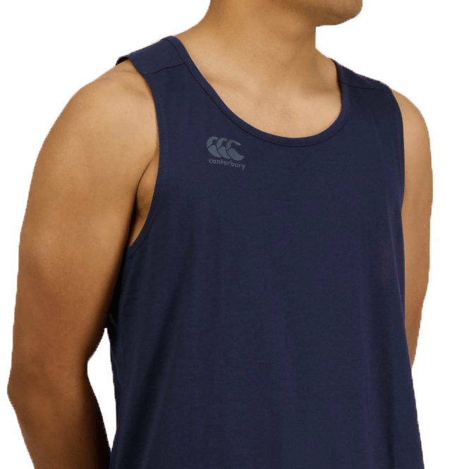 A person wearing a navy blue Canterbury Tempo Vapodri Singlet made from recycled polyester, featuring a "Canterbury" logo on the chest, is shown from the shoulders up, facing slightly right.