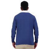 A man wearing a blue long-sleeved Canterbury Fundamentals Solid Long Sleeve Rugby jersey and beige pants, viewed from behind.