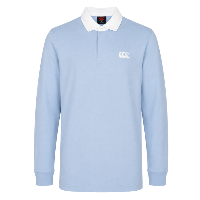 The Canterbury Solid Dye Rugby Jersey by Canterbury features a light blue color, long sleeves, white collar, and the classic logo on the left chest. Shown against a plain white background.