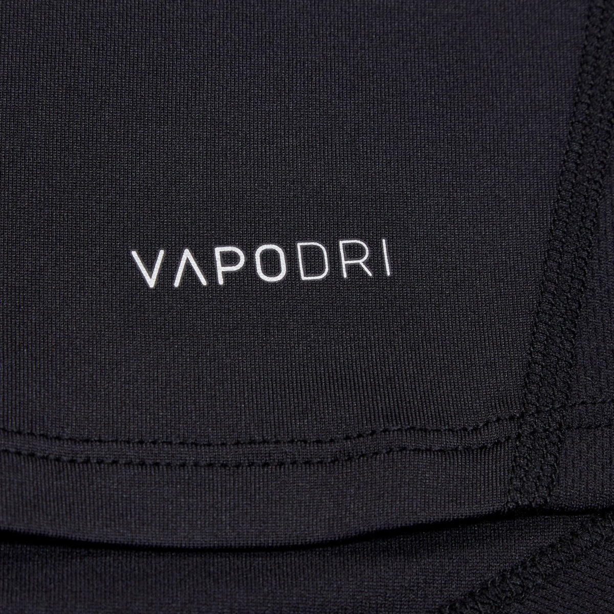 Close-up of a black Canterbury Small Logo Superlight Tee with the word “VAPODRI” printed in white.