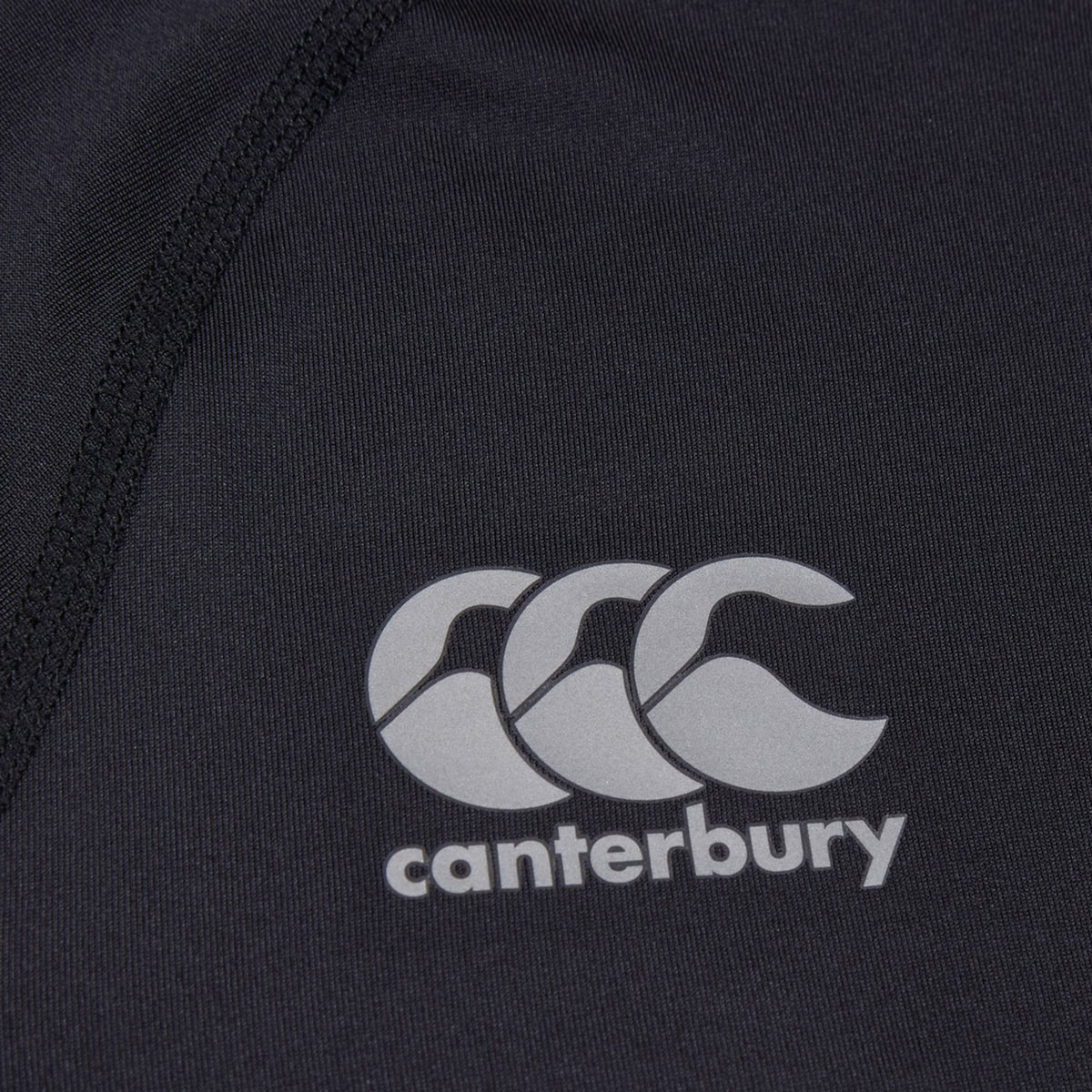 Black Canterbury Small Logo Superlight Tee with a grey logo featuring three stylized kiwis above the word “canterbury.”.