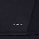 Close-up of a black Canterbury Large Logo Superlight Tee AM with visible stitching and "VAPODRI" in white, highlighting the brand's moisture-wicking technology.