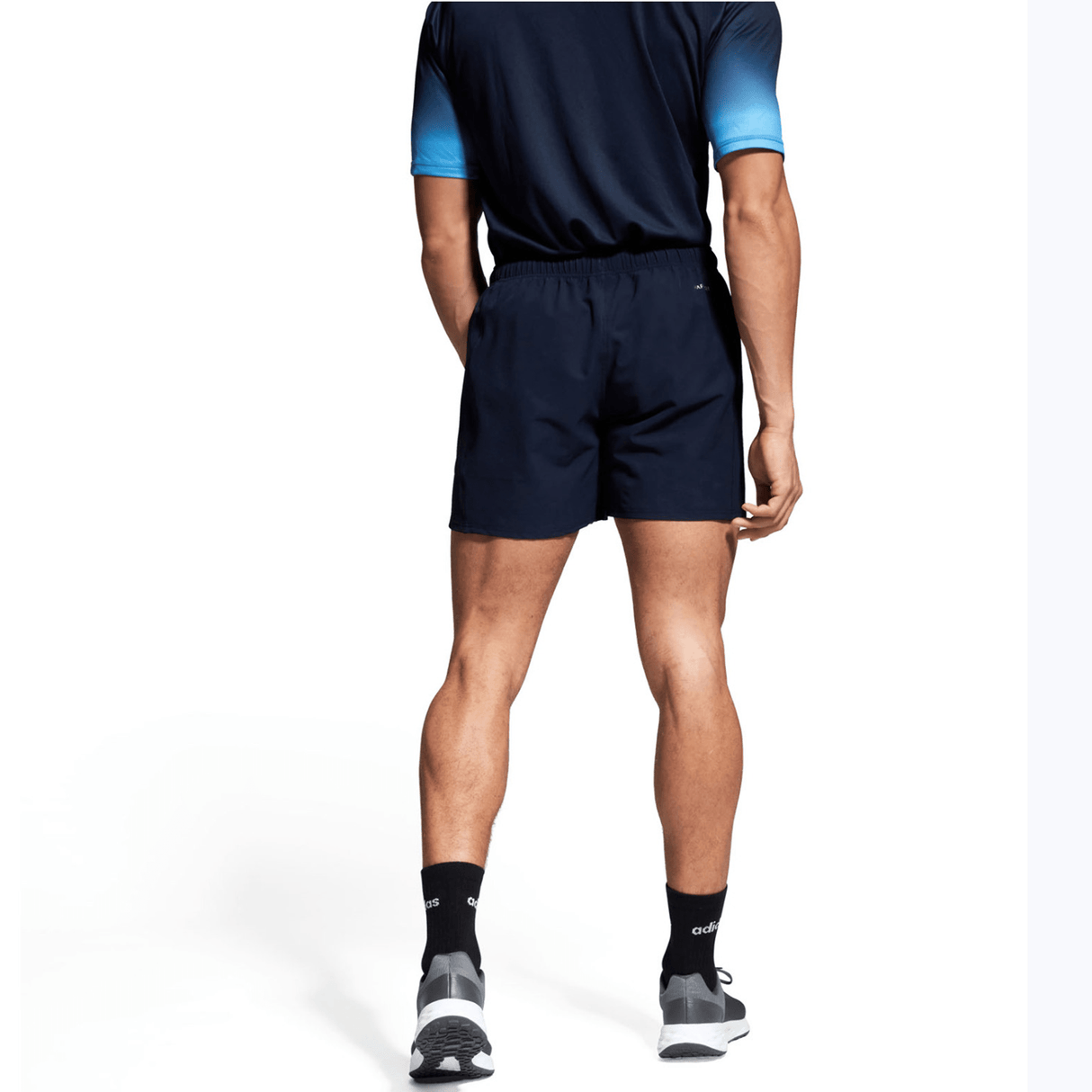 A man in a Canterbury Yokohama Short and black and blue shirt.