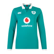 The Women's Ireland 25/26 Long Sleeve Classic Home Jersey by Canterbury features a green design with white collar, IRFU and Canterbury logos, Vodafone sponsor, and advanced VapoDri fabric for comfort and performance.