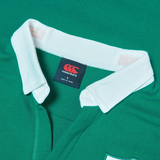 Close-up of the Ireland 25/26 Long Sleeve Classic Home Jersey by Canterbury, showcasing a green rugby shirt with a white collar and the "Canterbury" label.