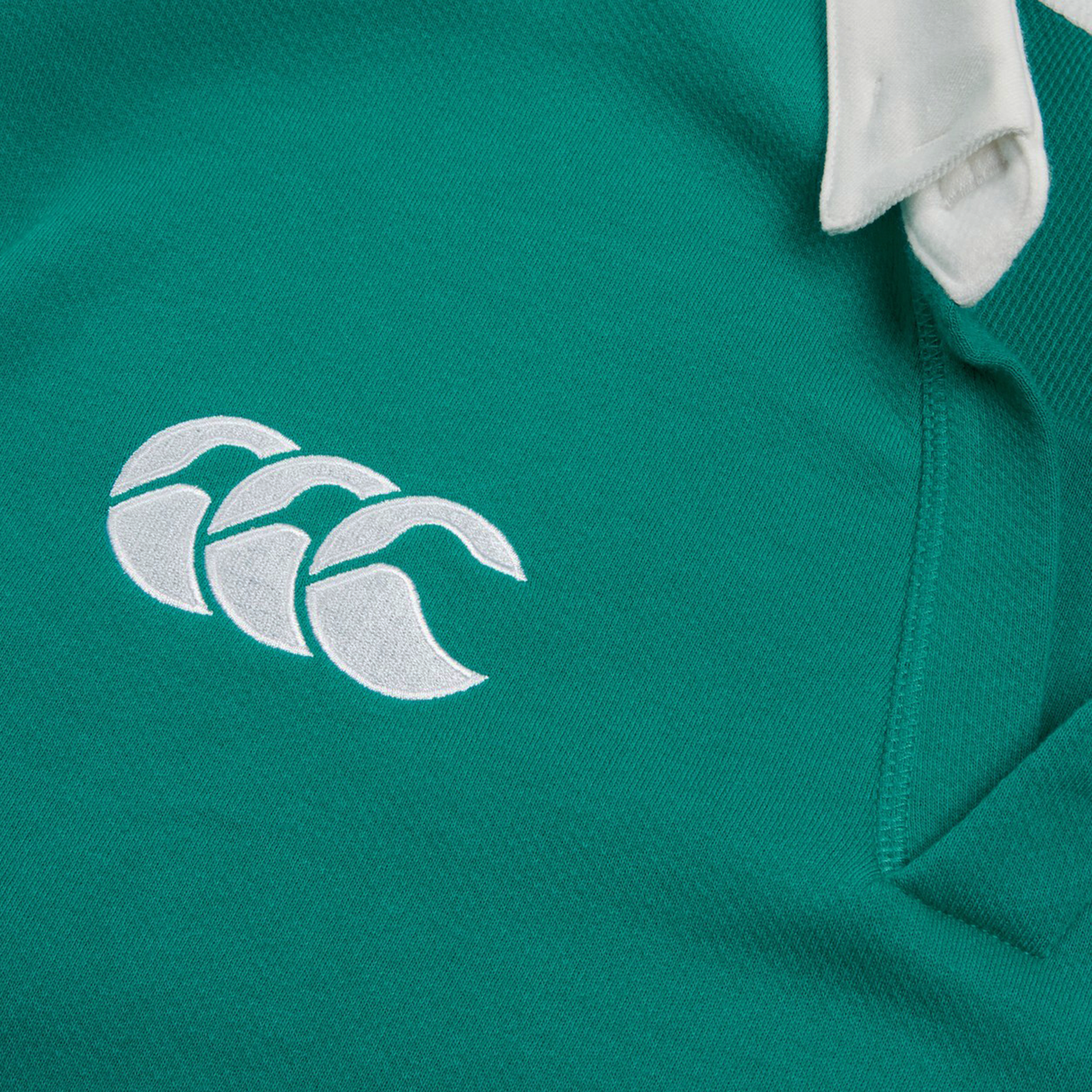 The Ireland 25/26 Classic Home Jersey by Canterbury showcases green fabric, a white triple-curve Canterbury logo embroidered near the seam, and a crisp white collar.